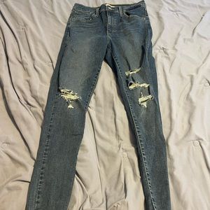 Ripped medium wash Levi Jeans